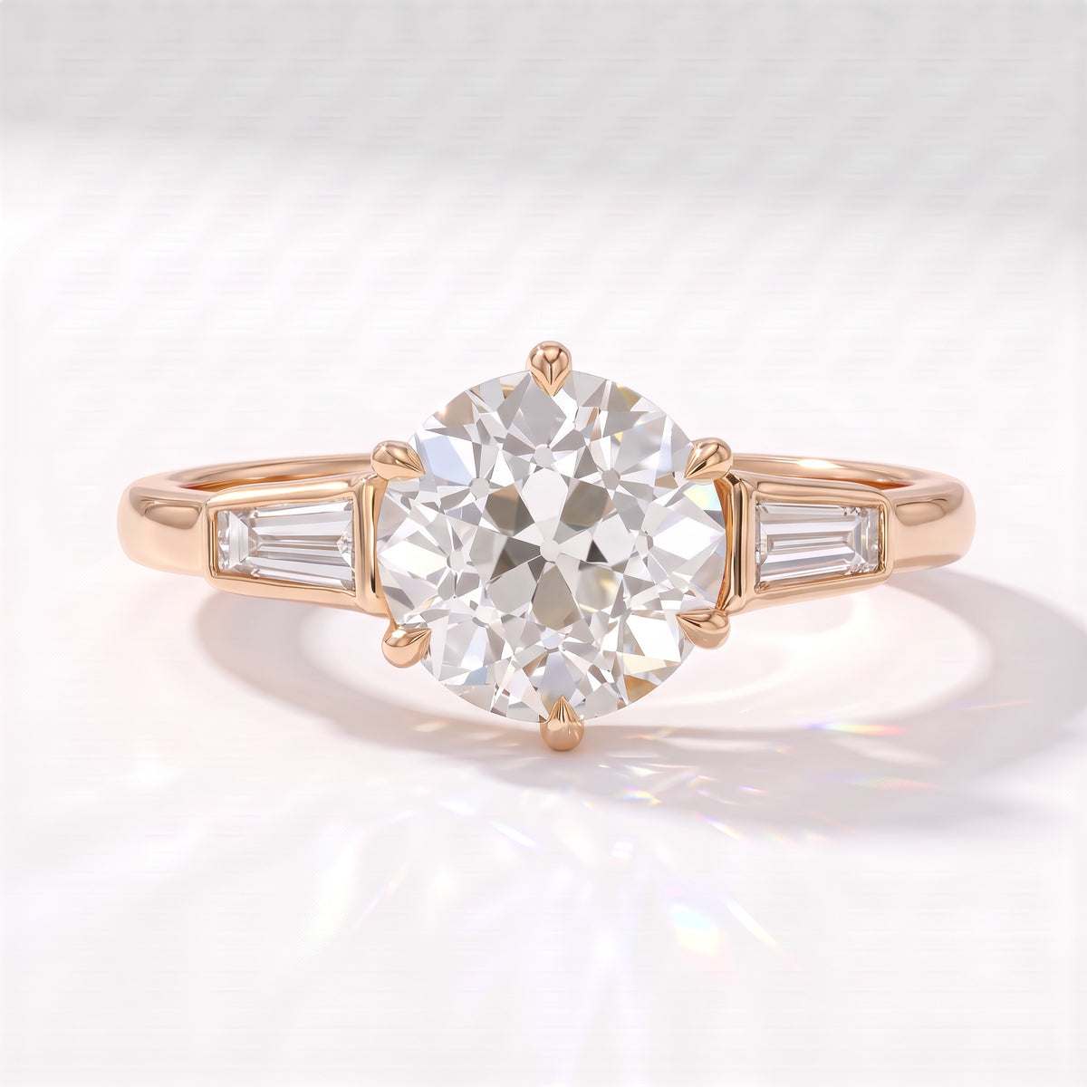 Old mine round lab-grown diamond vintage three-stone engagement ring with tapered baguettes in 18K (750) rose gold, front view 