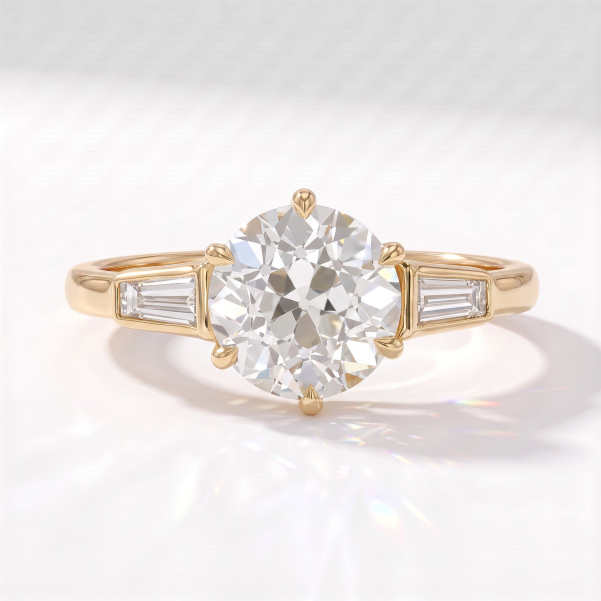 Old mine round lab-grown diamond vintage three-stone engagement ring with tapered baguettes in 18K (750) yellow gold, front view 