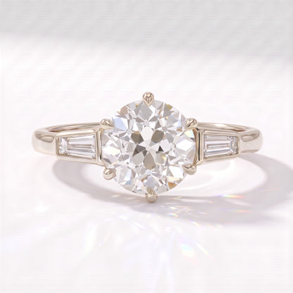 Old mine round lab-grown diamond vintage three-stone engagement ring with tapered baguettes in 950 platinum, front view 
