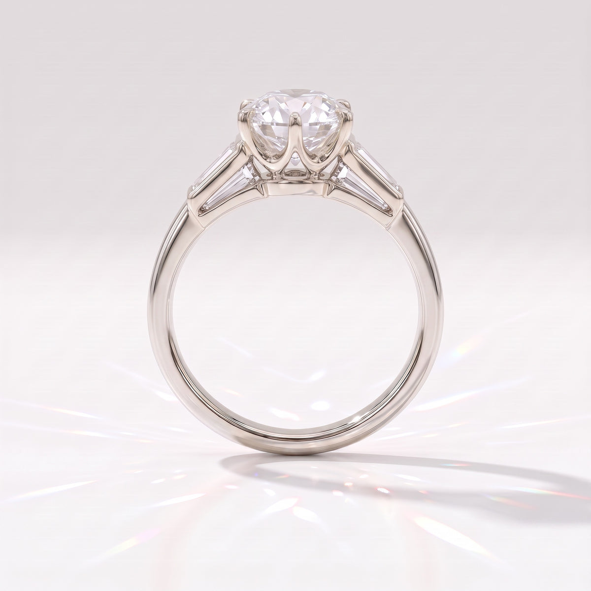 Old mine round lab-grown diamond vintage three-stone engagement ring with tapered baguettes in 950 platinum, profile view showing the six-claw crown basket 