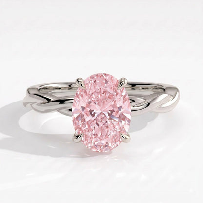 Fancy Vivid Pink oval lab-grown diamond solitaire engagement ring with twisted band in 14K (585) white gold, front view 