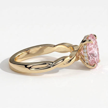 Fancy Vivid Pink oval lab-grown diamond solitaire engagement ring with twisted band in 14K (585) yellow gold, detail view of the twisted band 