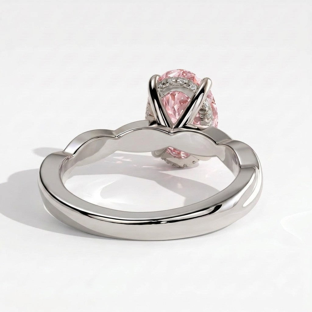 Fancy Vivid Pink oval lab-grown diamond solitaire engagement ring with twisted band in 18K (750) white gold, on white background 