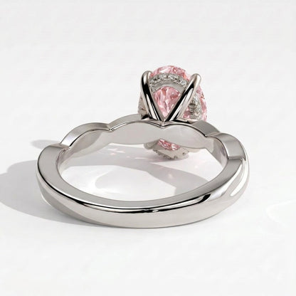 Fancy Vivid Pink oval lab-grown diamond solitaire engagement ring with twisted band in 18K (750) white gold, on white background 