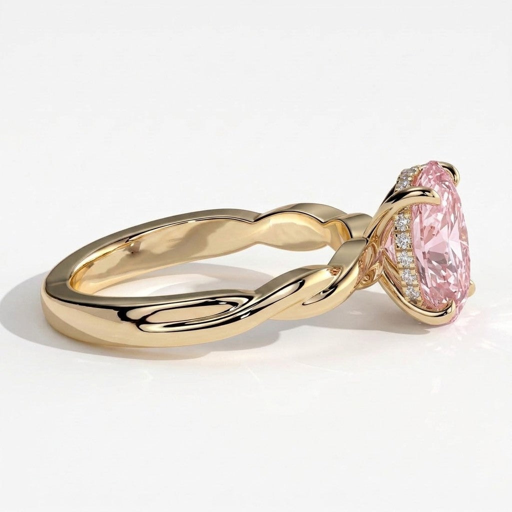 Fancy Vivid Pink oval lab-grown diamond solitaire engagement ring with twisted band in 18K (750) yellow gold, detail view of the twisted band 