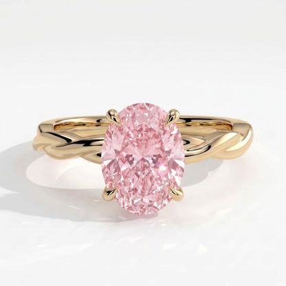 Fancy Vivid Pink oval lab-grown diamond solitaire engagement ring with twisted band in 18K (750) yellow gold, front view 