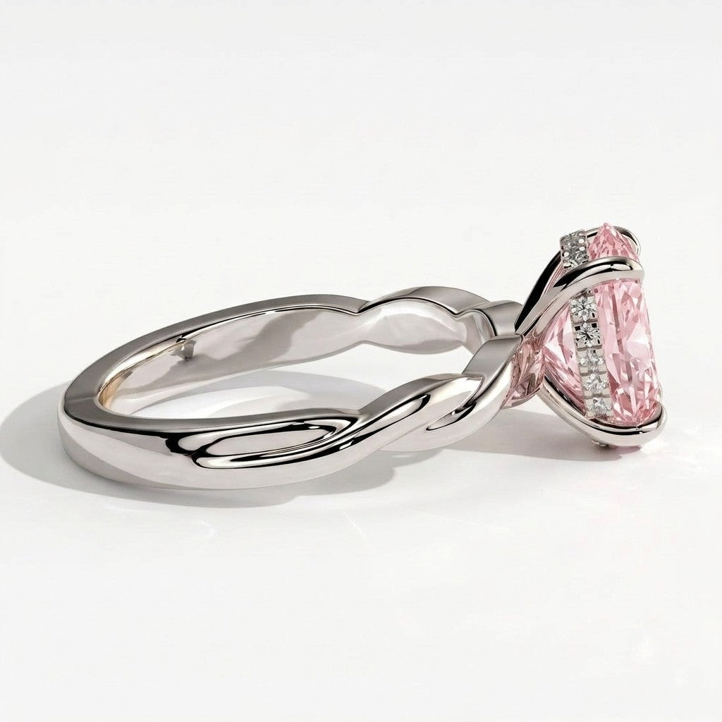Fancy Vivid Pink oval lab-grown diamond solitaire engagement ring with twisted band in 950 platinum, detail view of the twisted band 