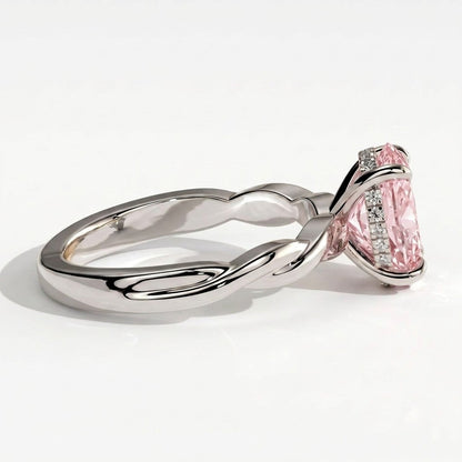 Fancy Vivid Pink oval lab-grown diamond solitaire engagement ring with twisted band in 950 platinum, detail view of the twisted band 
