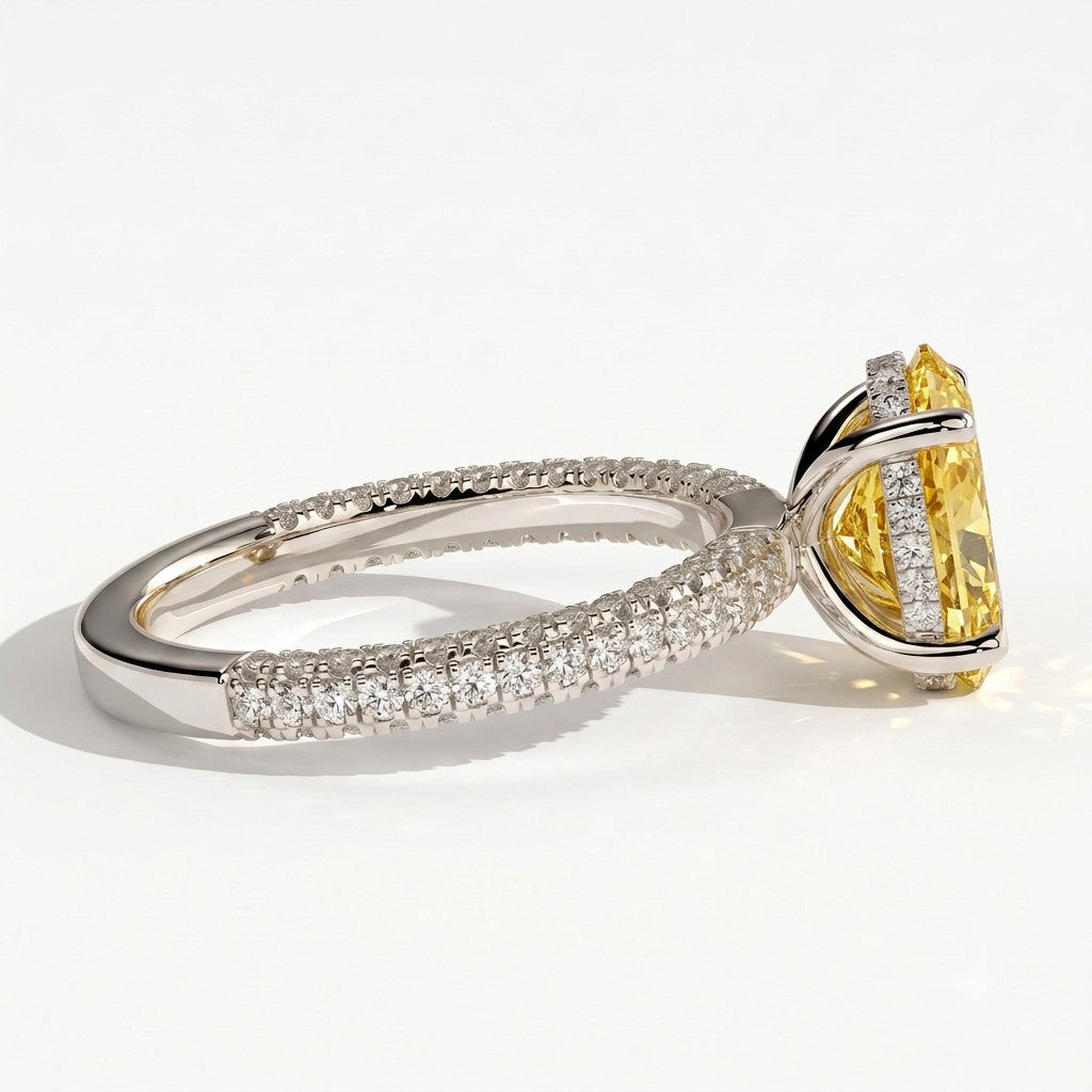 Fancy Vivid Yellow oval lab-grown diamond engagement ring with triple pavé band and hidden halo in 14K (585) white gold, detail view of the triple pavé band 