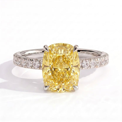 Fancy Vivid Yellow elongated cushion lab-grown diamond engagement ring with hidden halo and pavé band in 14K (585) white gold, front view 
