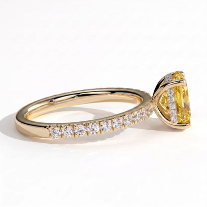 Fancy Vivid Yellow elongated cushion lab-grown diamond engagement ring with hidden halo and pavé band in 14K (585) yellow gold, detail view of the pavé band 