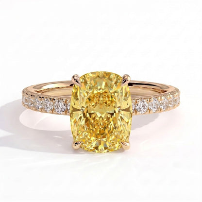 Fancy Vivid Yellow elongated cushion lab-grown diamond engagement ring with hidden halo and pavé band in 14K (585) yellow gold, front view 