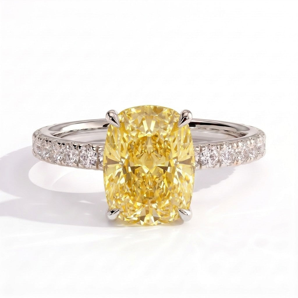 Fancy Vivid Yellow elongated cushion lab-grown diamond engagement ring with hidden halo and pavé band in 950 platinum, front view 