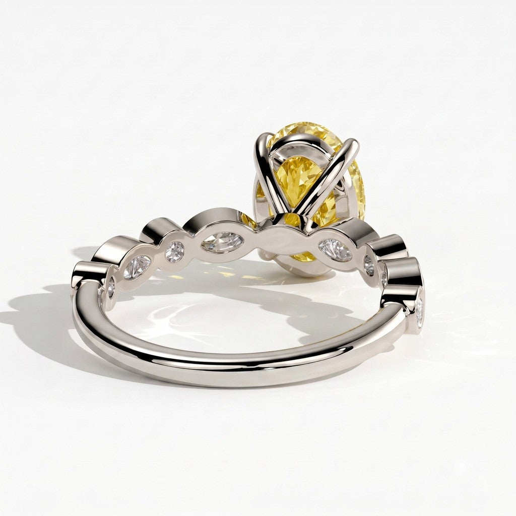Fancy Vivid Yellow oval lab-grown diamond engagement ring with bezel-set pear and round shoulder accents in 950 platinum, back view 