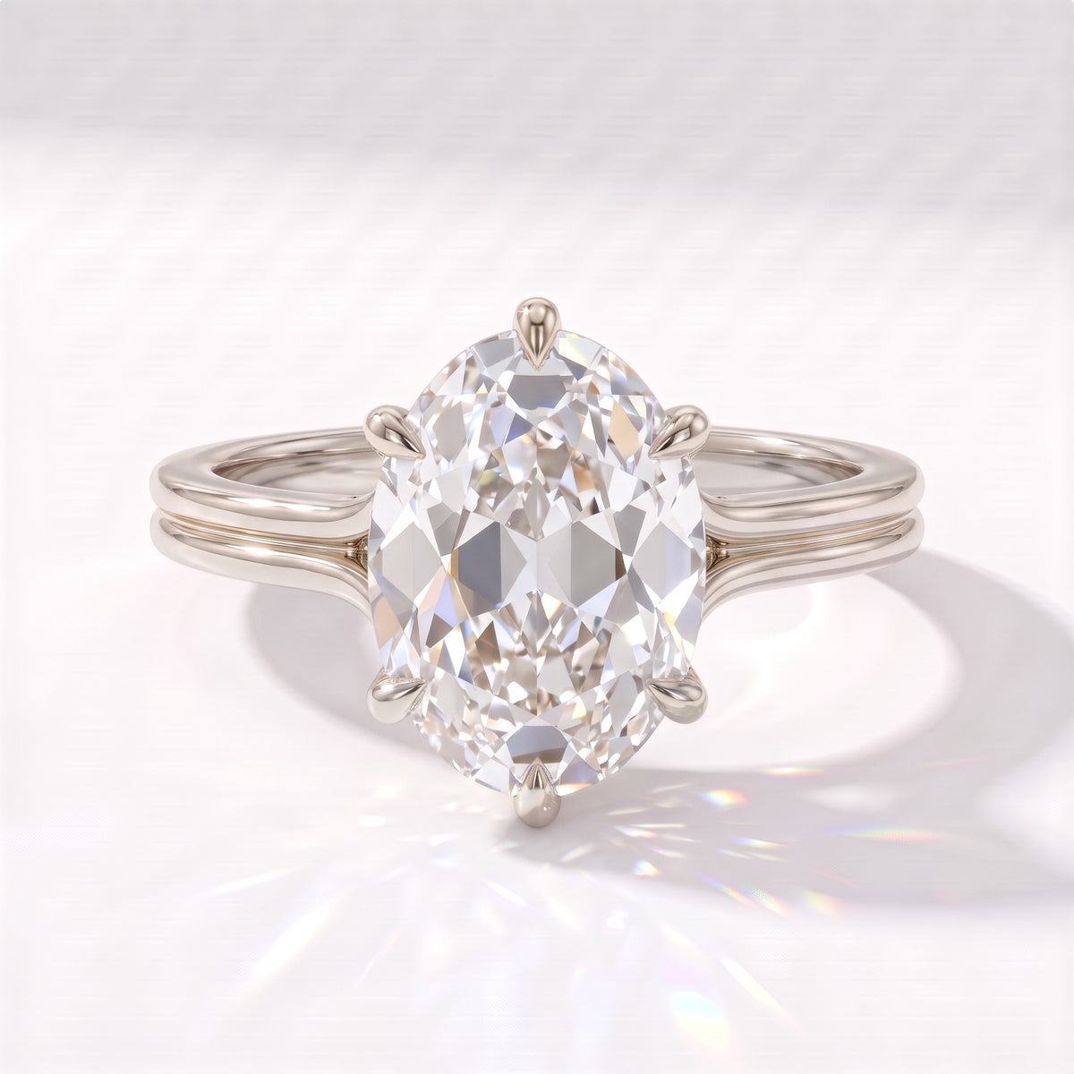 Antique cut oval lab-grown diamond vintage solitaire engagement ring with split shank and engraved gallery in 14K (585) white gold, front view 
