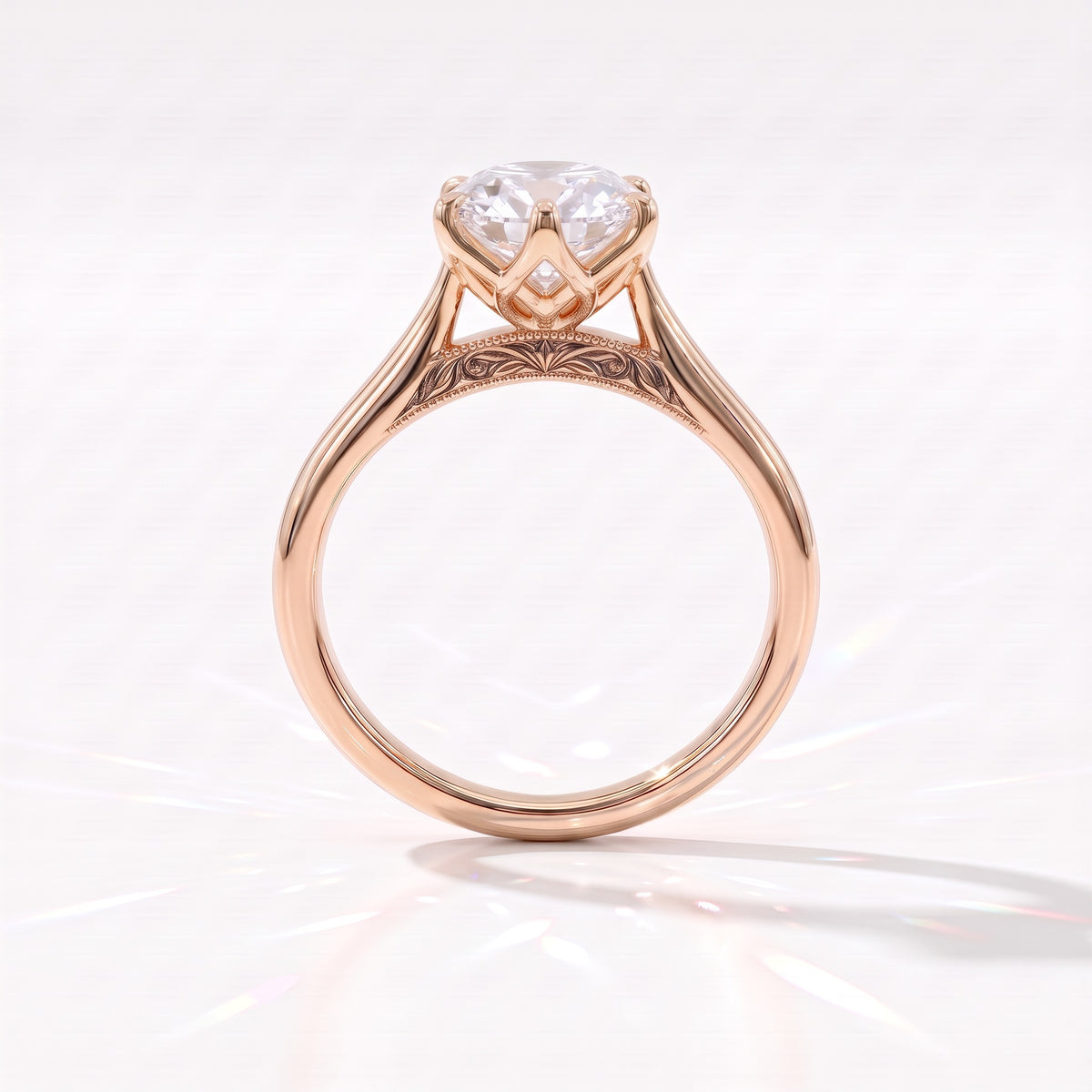 Antique cut oval lab-grown diamond vintage solitaire engagement ring with split shank and engraved gallery in 18K (750) rose gold, profile view showing the engraved gallery 