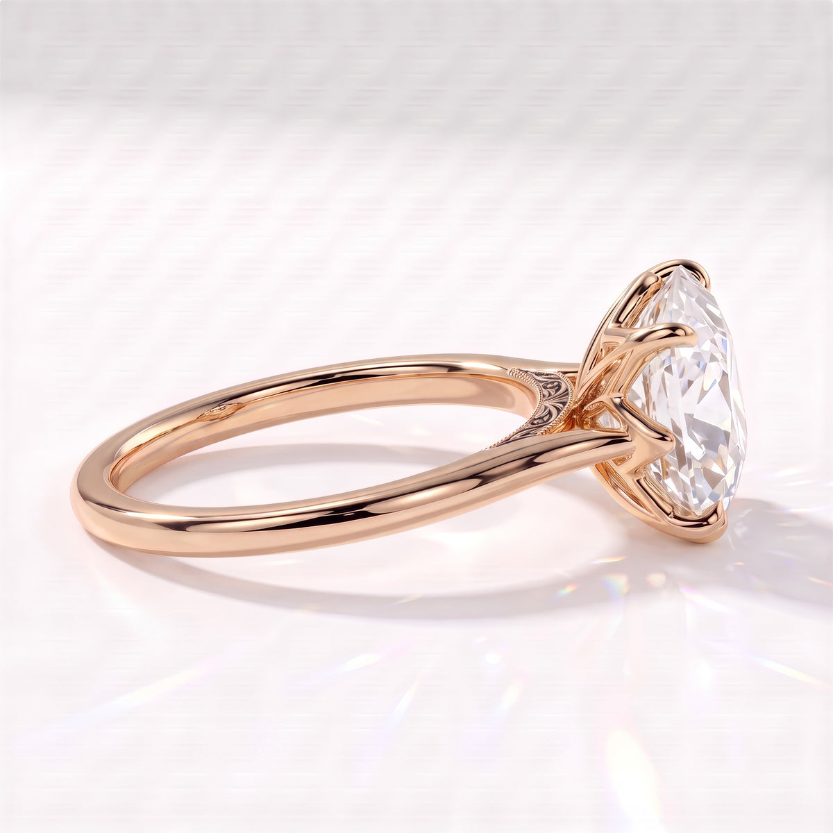 Antique cut oval lab-grown diamond vintage solitaire engagement ring with split shank and engraved gallery in 18K (750) rose gold, side view showing the engraved gallery 