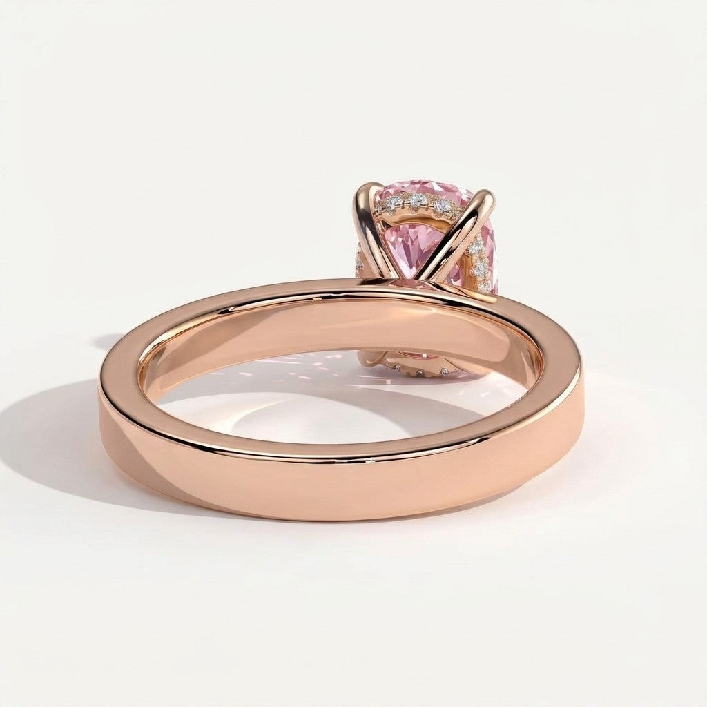 Fancy Vivid Pink elongated cushion lab-grown diamond engagement ring with flat cigar band and hidden halo in 14K (585) rose gold, on white background 