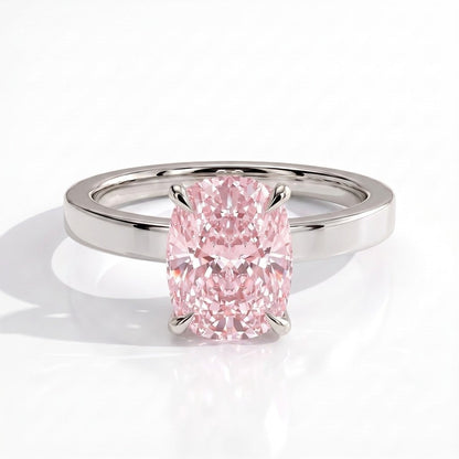 Fancy Vivid Pink elongated cushion lab-grown diamond engagement ring with flat cigar band and hidden halo in 18K (750) white gold, front view 