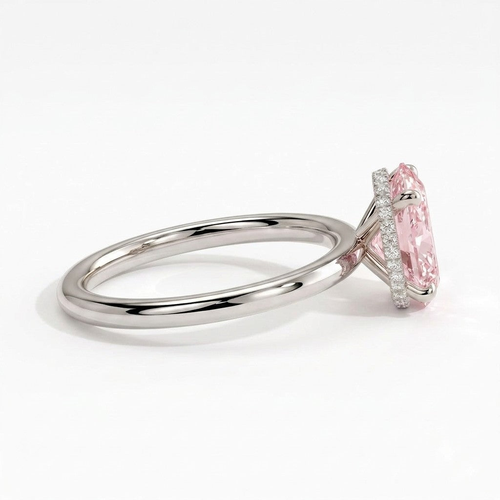 Fancy Vivid Pink oval lab-grown diamond engagement ring with wrap-around hidden halo in 18K (750) white gold, detail view of the wrap-around hidden halo 
