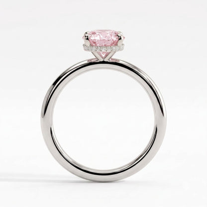 Fancy Vivid Pink oval lab-grown diamond engagement ring with wrap-around hidden halo in 18K (750) white gold, side profile showing the hidden halo 