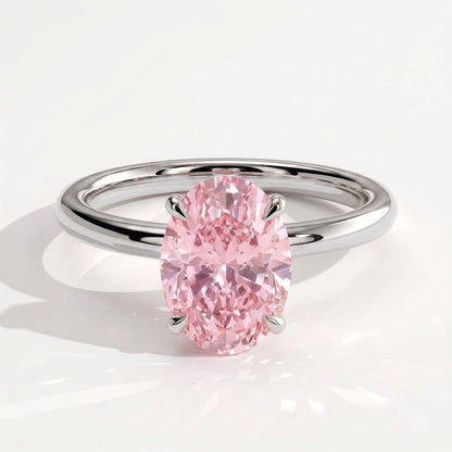Fancy Vivid Pink oval lab-grown diamond engagement ring with wrap-around hidden halo in 950 platinum, front view 