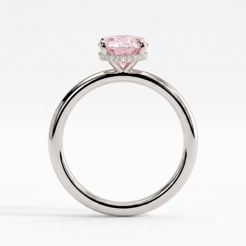 Fancy Vivid Pink oval lab-grown diamond engagement ring with wrap-around hidden halo in 950 platinum, side profile showing the hidden halo 