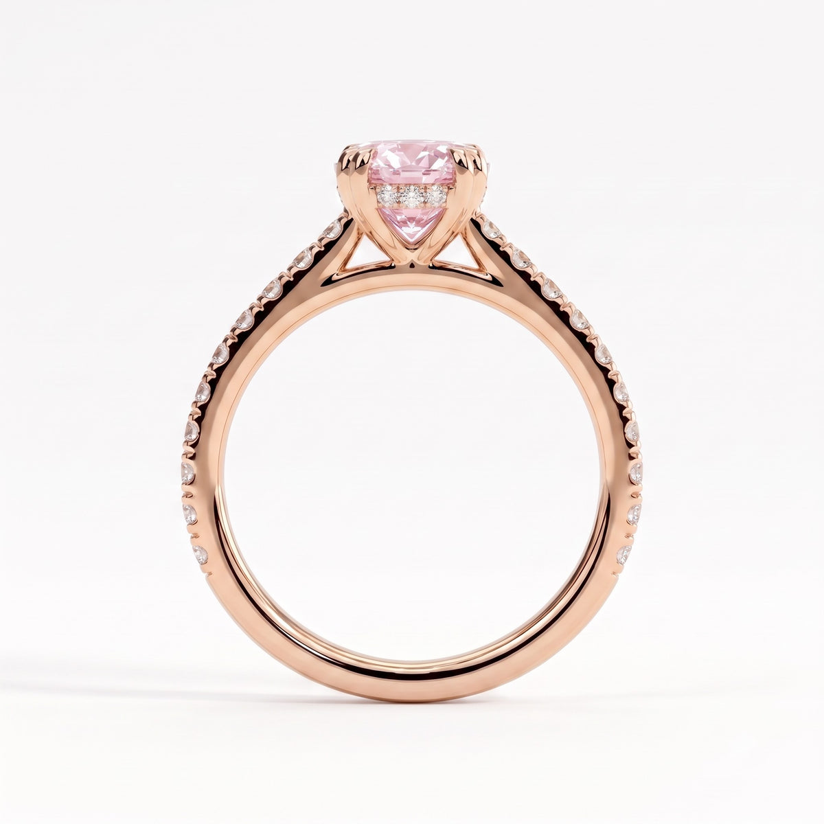 Fancy Vivid Pink oval lab-grown diamond double claw engagement ring with pavé band and hidden halo in 14K (585) rose gold, side profile showing the cathedral setting 