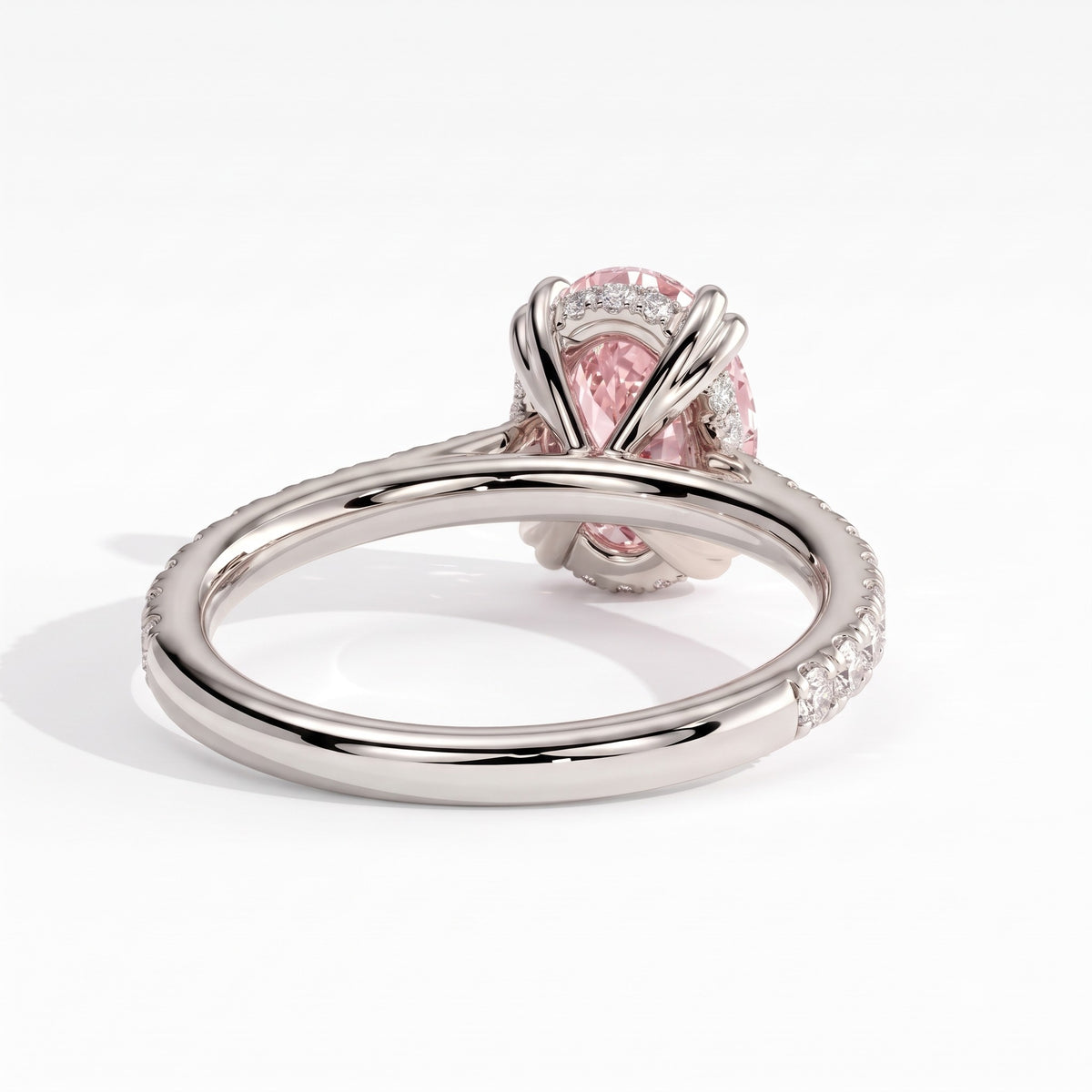 Fancy Vivid Pink oval lab-grown diamond double claw engagement ring with pavé band and hidden halo in 14K (585) white gold, back view showing the hidden halo 