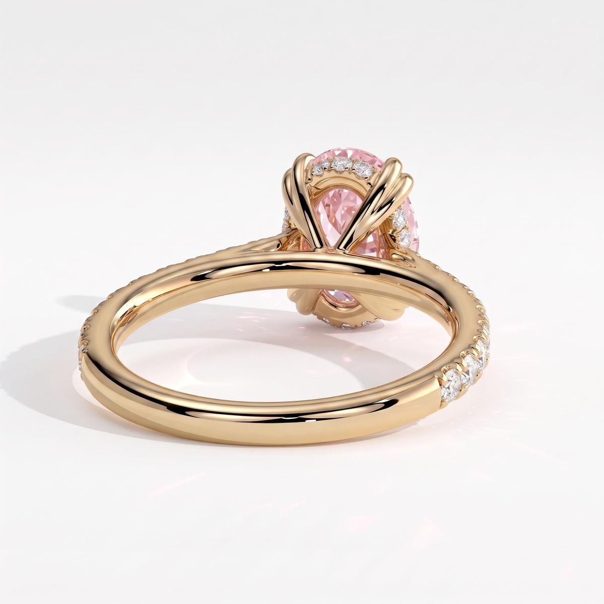Fancy Vivid Pink oval lab-grown diamond double claw engagement ring with pavé band and hidden halo in 14K (585) yellow gold, back view showing the hidden halo 
