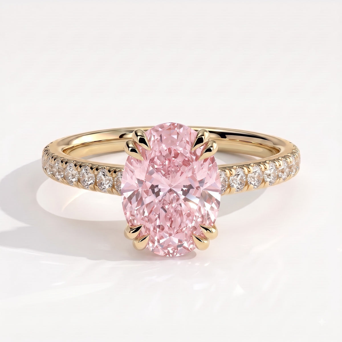 Fancy Vivid Pink oval lab-grown diamond double claw engagement ring with pavé band and hidden halo in 14K (585) yellow gold, front view 