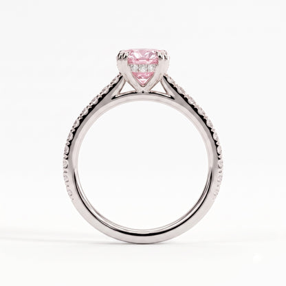 Fancy Vivid Pink oval lab-grown diamond double claw engagement ring with pavé band and hidden halo in 950 platinum, side profile showing the cathedral setting 