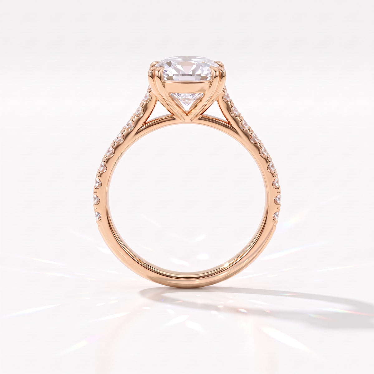 Old mine cushion lab-grown diamond vintage solitaire engagement ring with pavé band in 14K (585) rose gold, profile view showing the double-claw gallery 