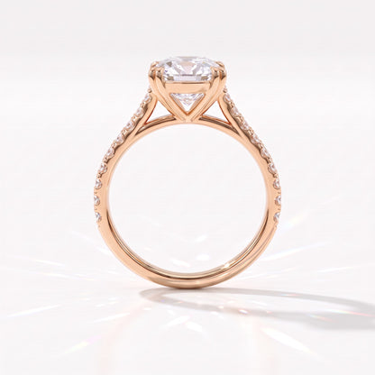 Old mine cushion lab-grown diamond vintage solitaire engagement ring with pavé band in 14K (585) rose gold, profile view showing the double-claw gallery 