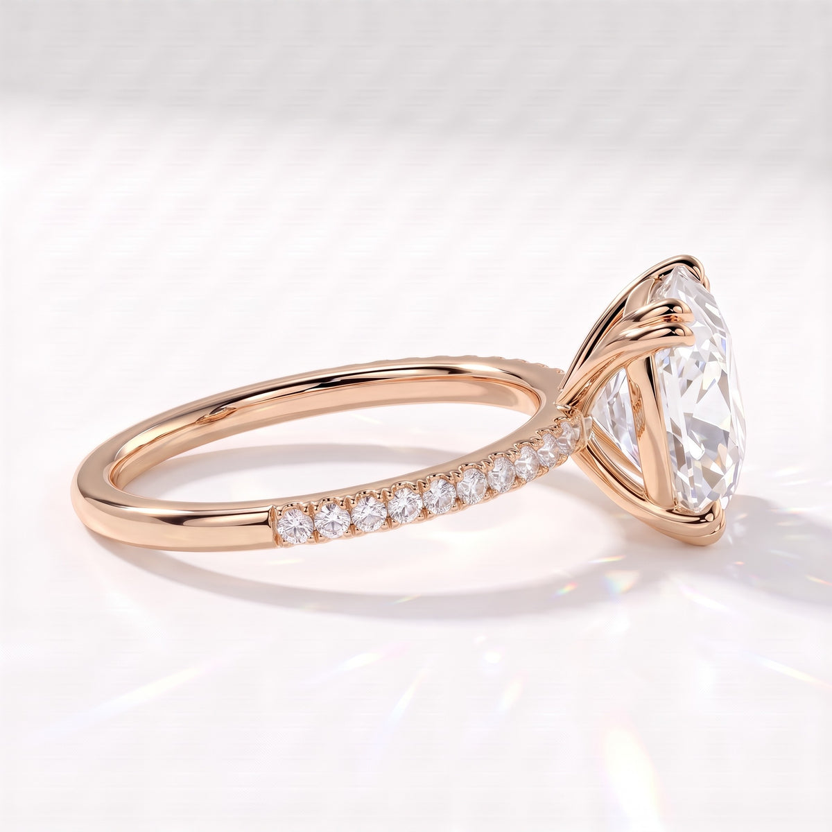Old mine cushion lab-grown diamond vintage solitaire engagement ring with pavé band in 14K (585) rose gold, side view showing the pavé band 