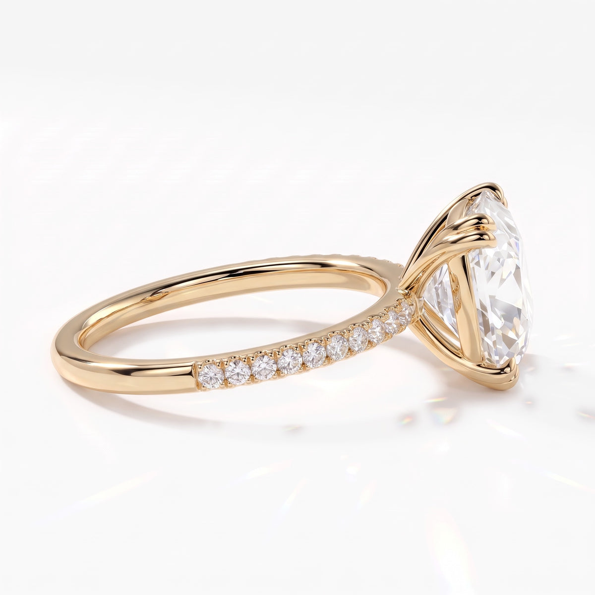 Old mine cushion lab-grown diamond vintage solitaire engagement ring with pavé band in 18K (750) yellow gold, side view showing the pavé band 