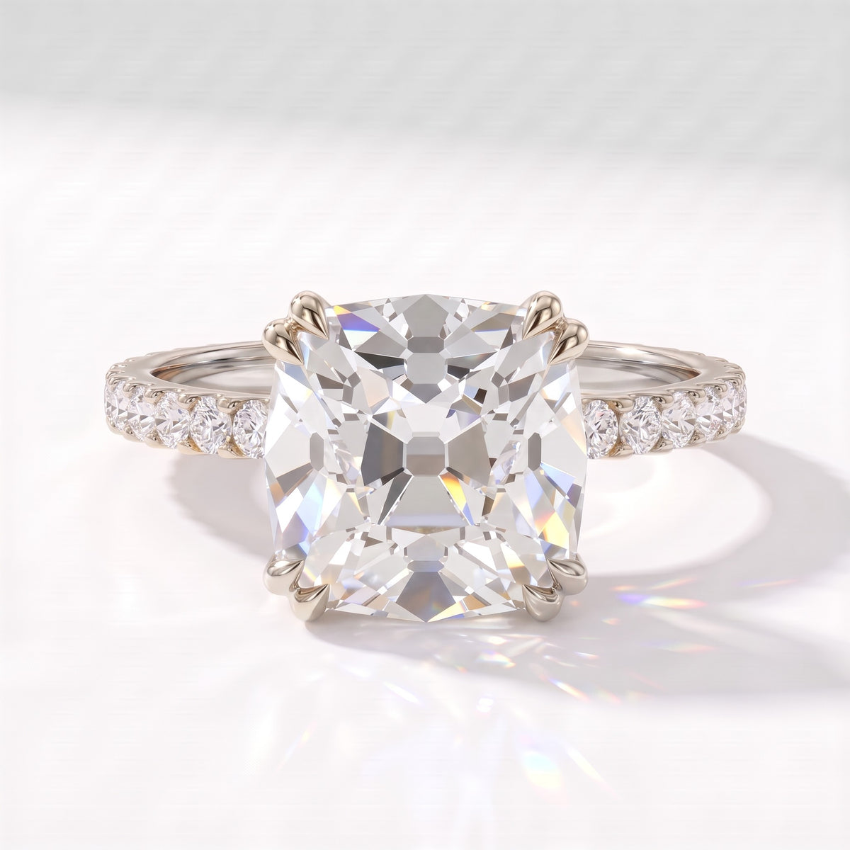 Old mine cushion lab-grown diamond vintage solitaire engagement ring with pavé band in 950 platinum, front view 