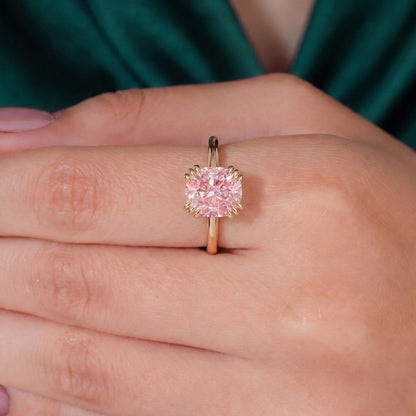 Fancy Vivid Pink elongated cushion lab-grown diamond solitaire engagement ring with triple claw prongs in 14K (585) yellow gold, three-quarter view 