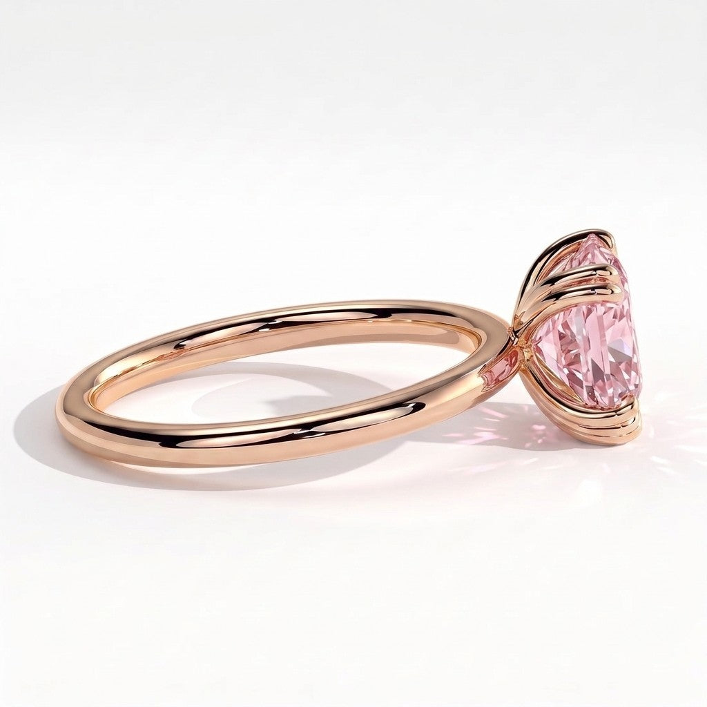 Fancy Vivid Pink elongated cushion lab-grown diamond solitaire engagement ring with triple claw prongs in 18K (750) rose gold, on white background 