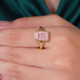 Fancy Vivid Pink radiant lab-grown diamond bezel ring in 950 platinum, worn on finger, on-hand top view 