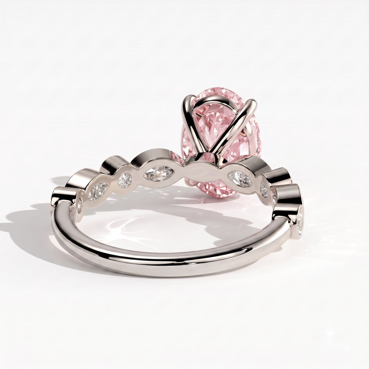 Fancy Vivid Pink oval lab-grown diamond engagement ring with bezel-set pear and round shoulder accents in 14K (585) white gold, back view 