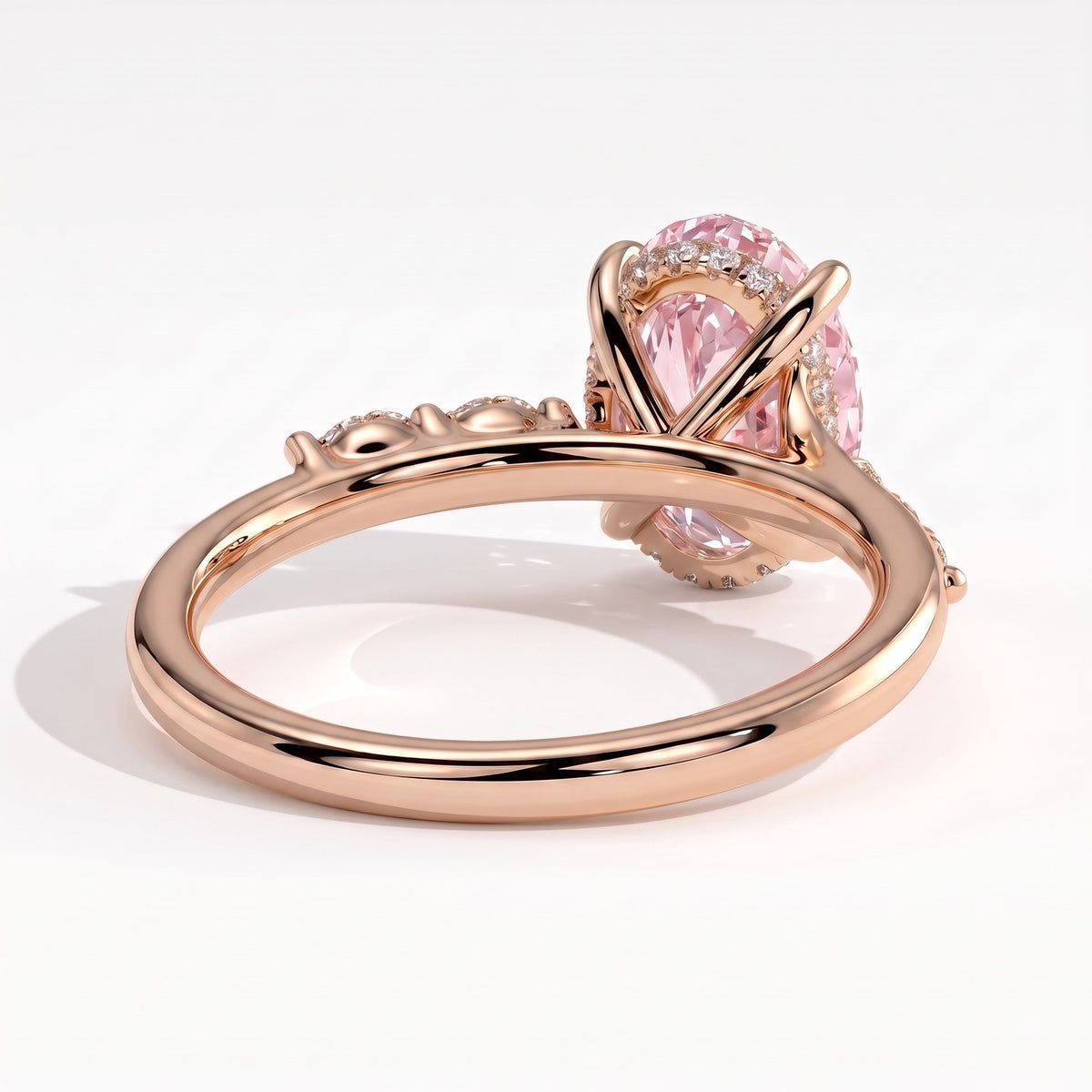 Fancy Vivid Pink oval lab-grown diamond hidden halo engagement ring with marquise accents in 14K (585) rose gold, back view showing the hidden halo 