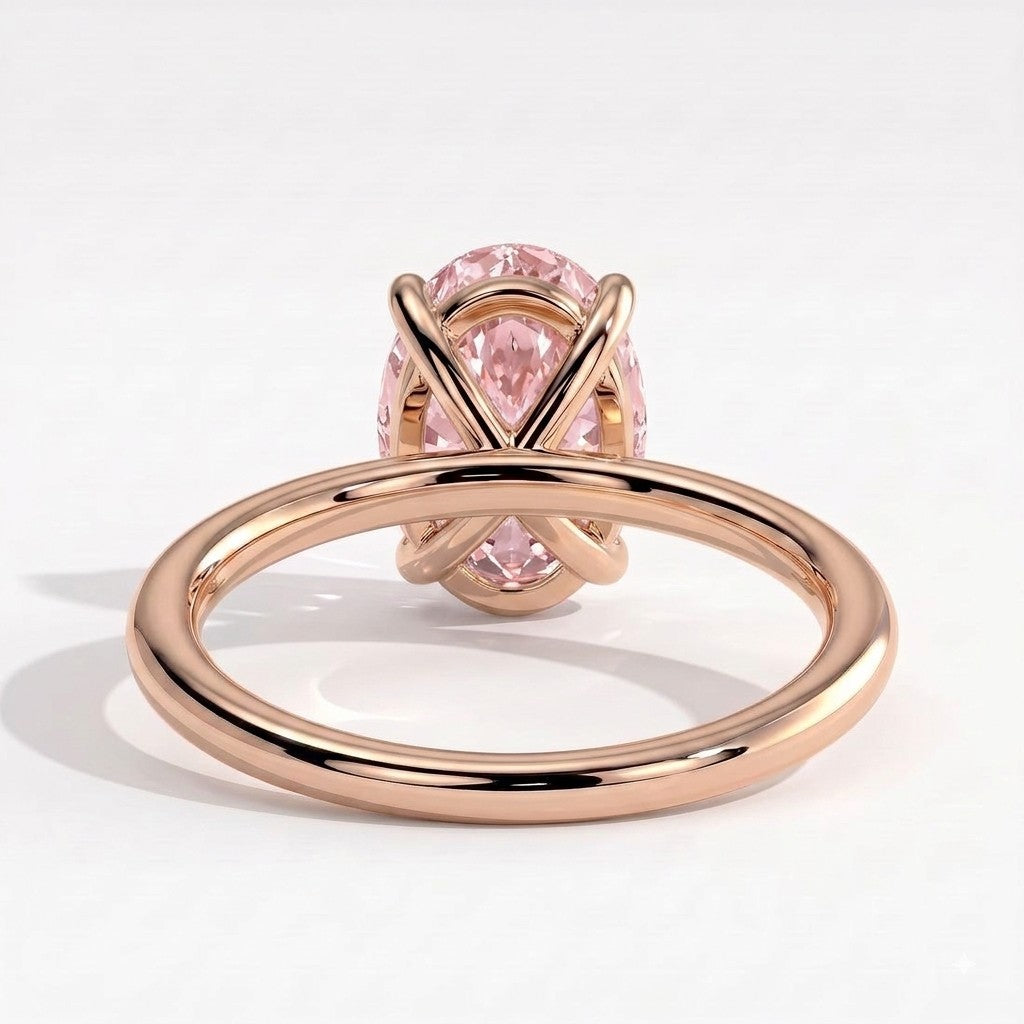 Fancy Vivid Pink oval lab-grown diamond solitaire engagement ring in 18K (750) rose gold, on white background 
