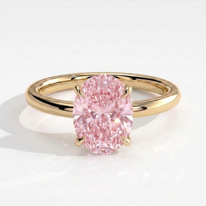 Fancy Vivid Pink oval lab-grown diamond solitaire engagement ring in 18K (750) yellow gold, front view 