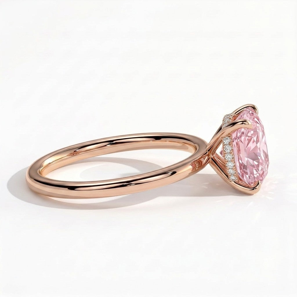 Fancy Vivid Pink elongated cushion lab-grown diamond engagement ring with wrap-around hidden halo in 14K (585) rose gold, detail view of the wrap-around hidden halo 