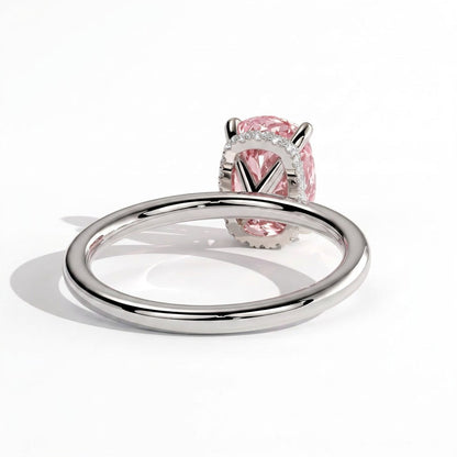 Fancy Vivid Pink elongated cushion lab-grown diamond engagement ring with wrap-around hidden halo in 14K (585) white gold, on white background 