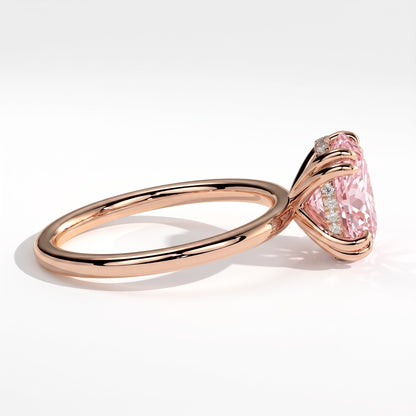 Fancy Vivid Pink oval lab-grown diamond double claw engagement ring with hidden halo in 14K (585) rose gold, detail view of the double claws 