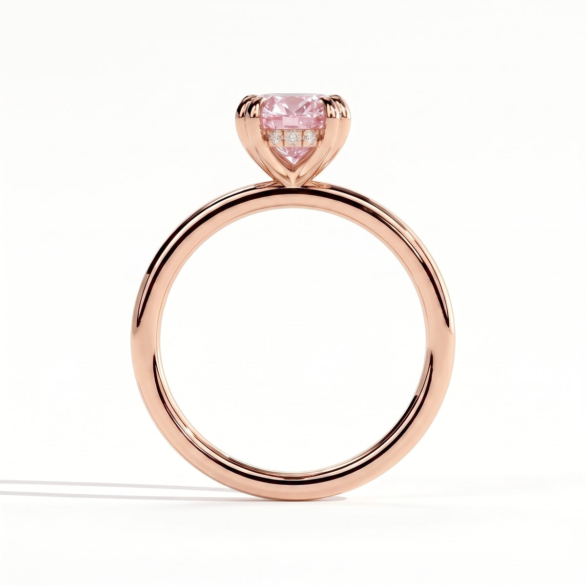 Fancy Vivid Pink oval lab-grown diamond double claw engagement ring with hidden halo in 14K (585) rose gold, side profile showing the hidden halo 