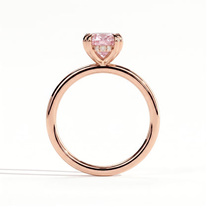 Fancy Vivid Pink oval lab-grown diamond double claw engagement ring with hidden halo in 18K (750) rose gold, side profile showing the hidden halo 