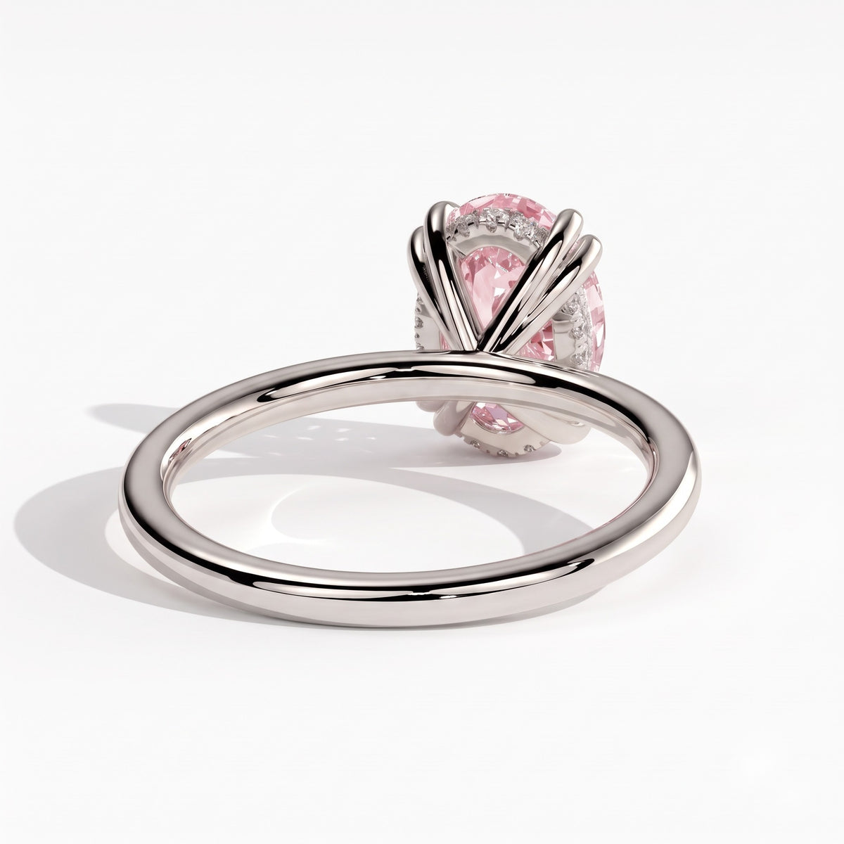 Fancy Vivid Pink oval lab-grown diamond double claw engagement ring with hidden halo in 950 platinum, back view 